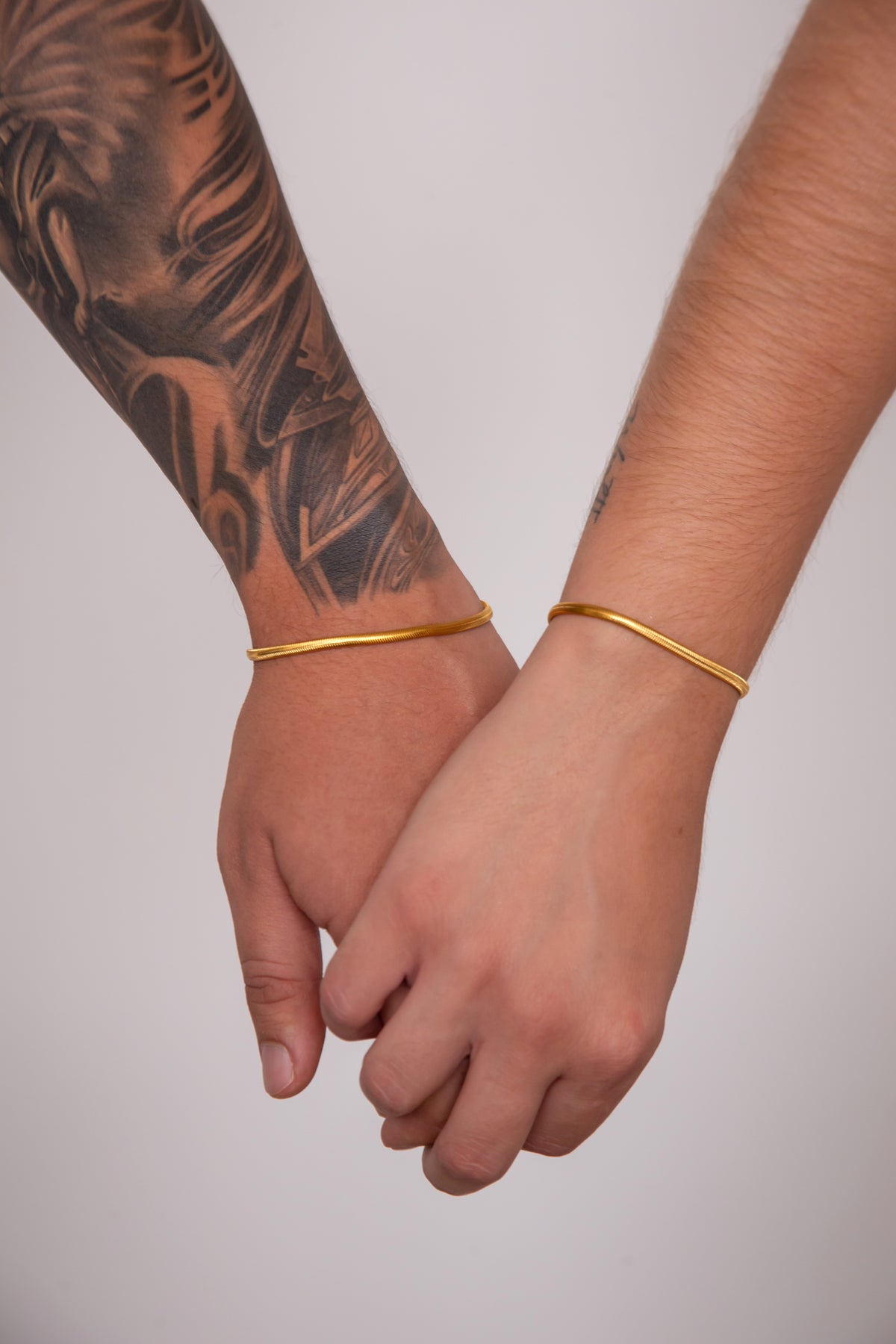 Set pulseras tejido serpiente para parejas