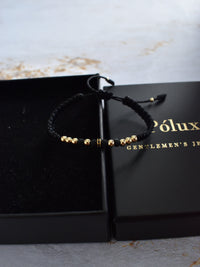 Pulsera Dominus Negro Oro Laminado 18K