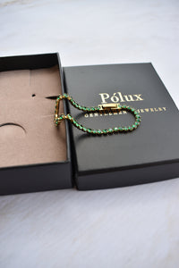 Set pulseras tejido tennis golden esmeralda para parejas