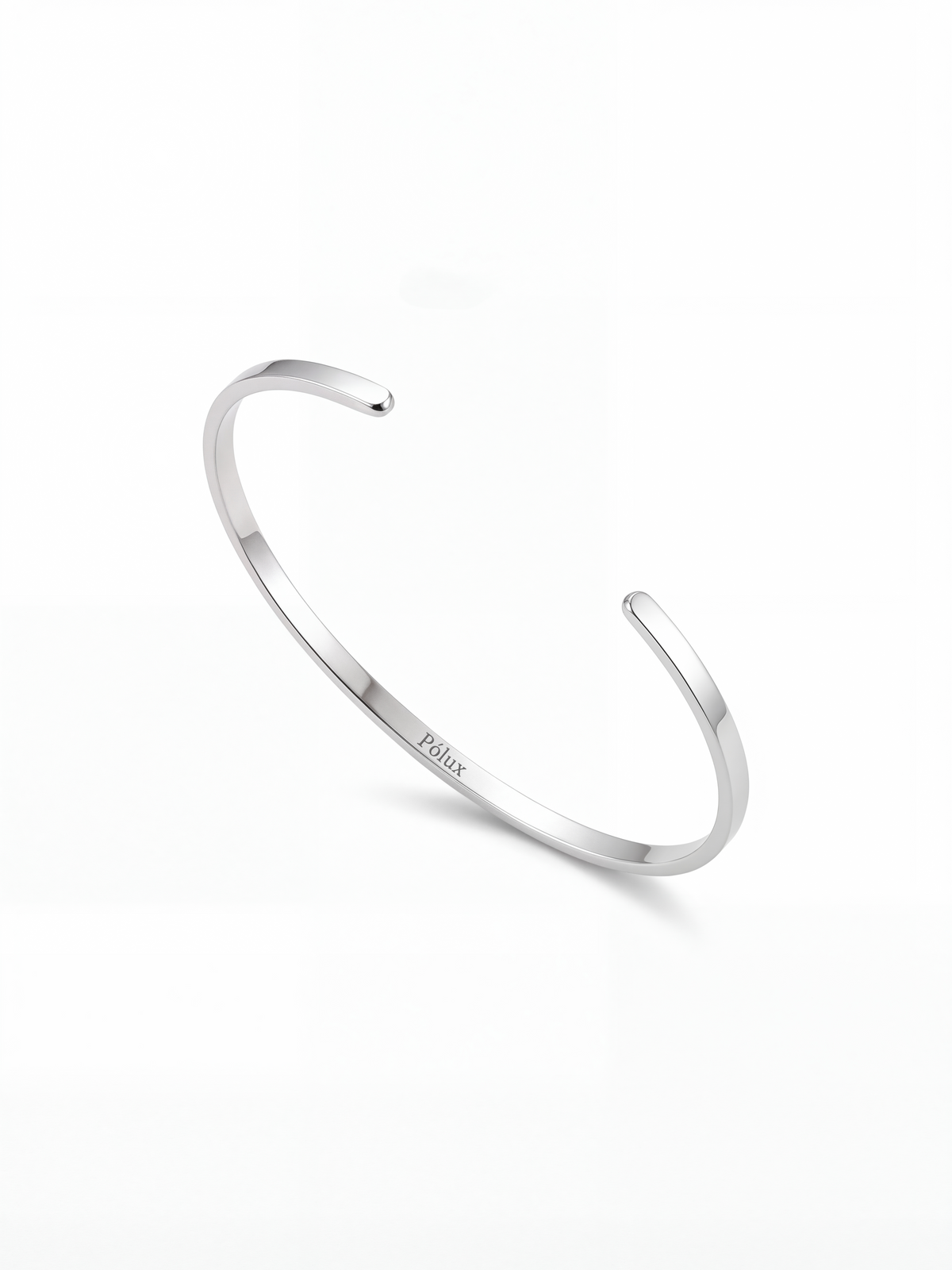 Brazalete plateado en acero quirúrgico con grabado Pólux, diseño minimalista unisex, acabado brillante.