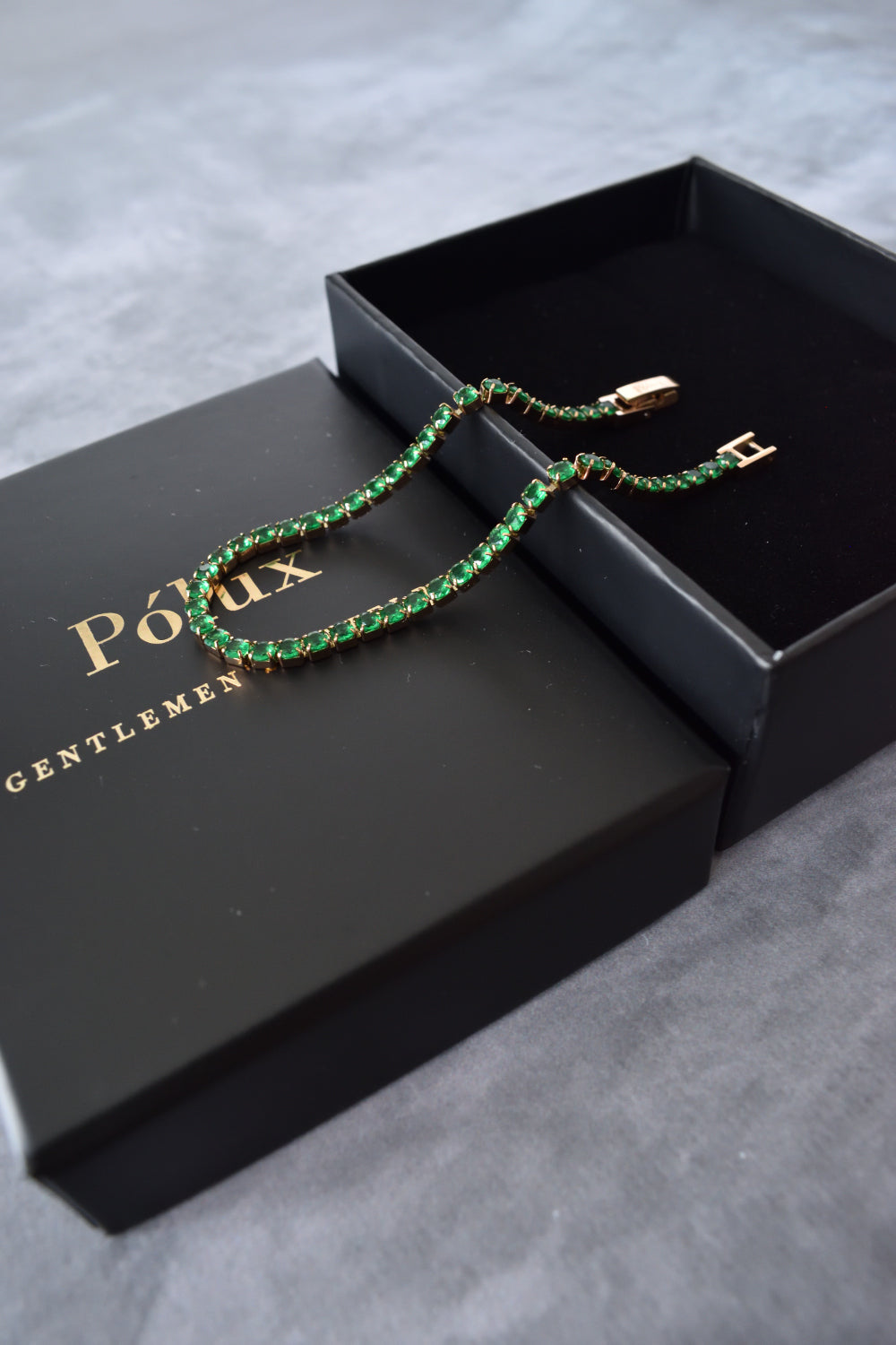 Pulsera tennis oro rosa circones verdes esmeralda acero quirúrgico