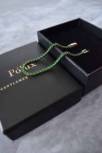 Pulsera tennis oro rosa circones verdes esmeralda acero quirúrgico