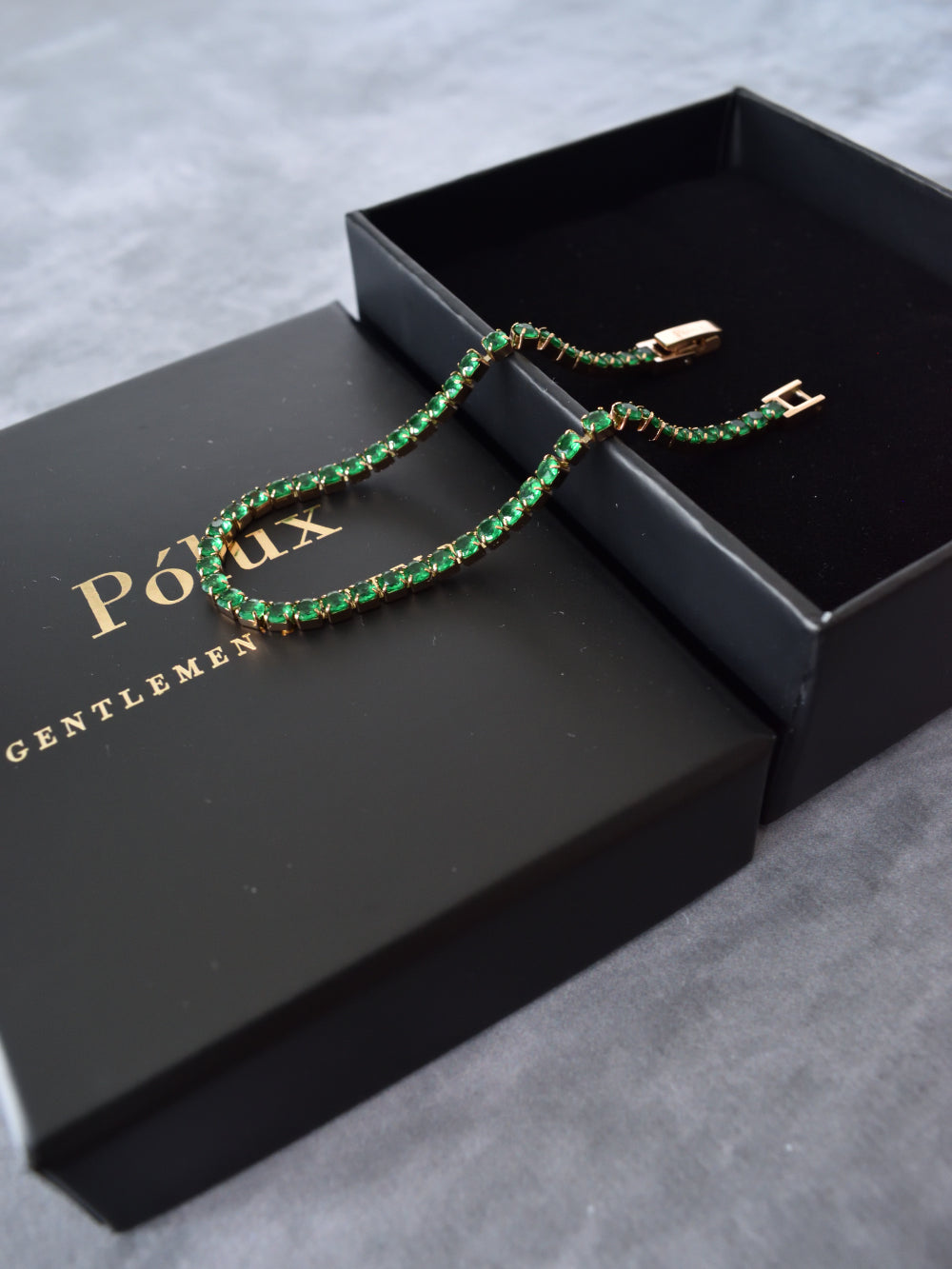 Pulsera tennis oro rosa circones verdes esmeralda acero quirúrgico