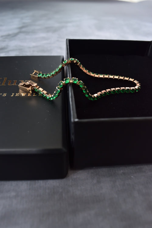 Pulsera tennis oro rosa circones verdes esmeralda acero quirúrgico