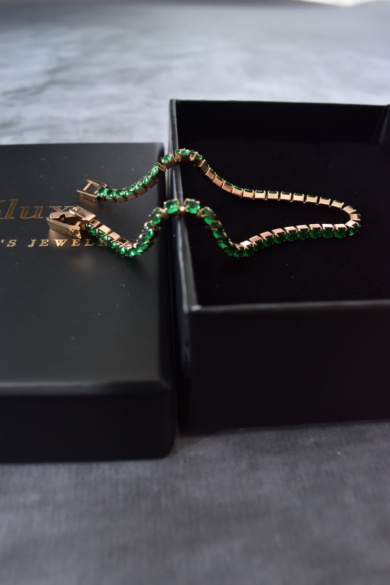 Pulsera tennis oro rosa circones verdes esmeralda acero quirúrgico