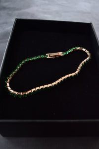 Pulsera tennis oro rosa circones verdes esmeralda acero quirúrgico