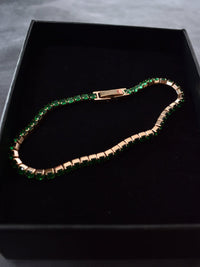 Pulsera tennis oro rosa circones verdes esmeralda acero quirúrgico