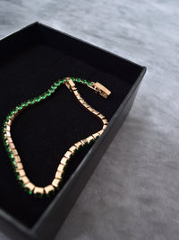 Pulsera tennis oro rosa circones verdes esmeralda acero quirúrgico