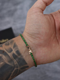 Pulsera tennis oro rosa circones verdes esmeralda acero quirúrgico