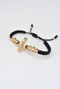 Pulsera Tío Rico en oro laminado 18K presentada dentro de la caja de regalo Pólux