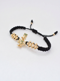 Pulsera Tío Rico en oro laminado 18K presentada dentro de la caja de regalo Pólux