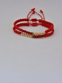 Set de 2 pulseras Afrodita rojas oro laminado 18K, vista en ángulo